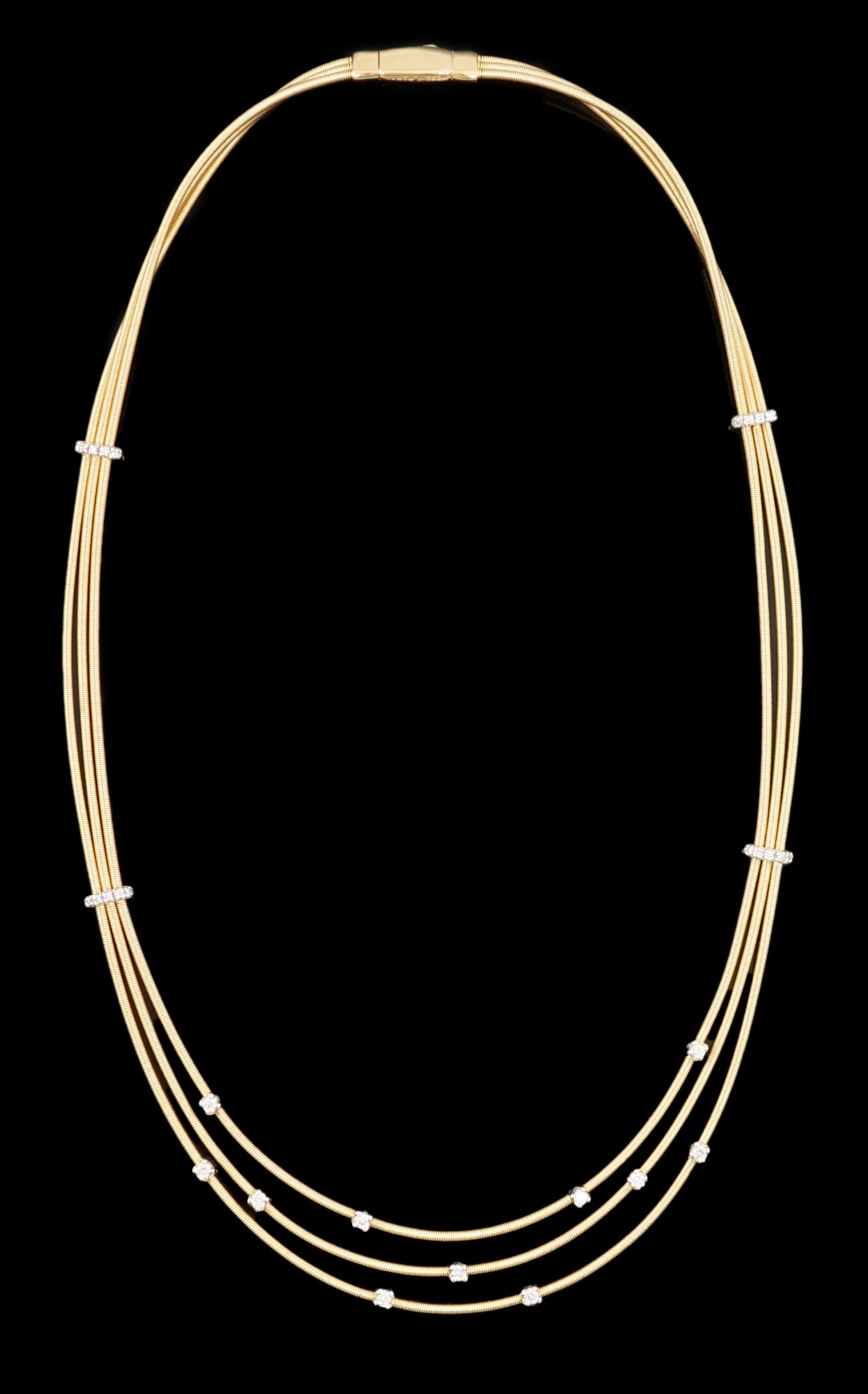 A modern Italian Marco Bicego 18ct gold and eleven stone diamond chip set triple strand necklace